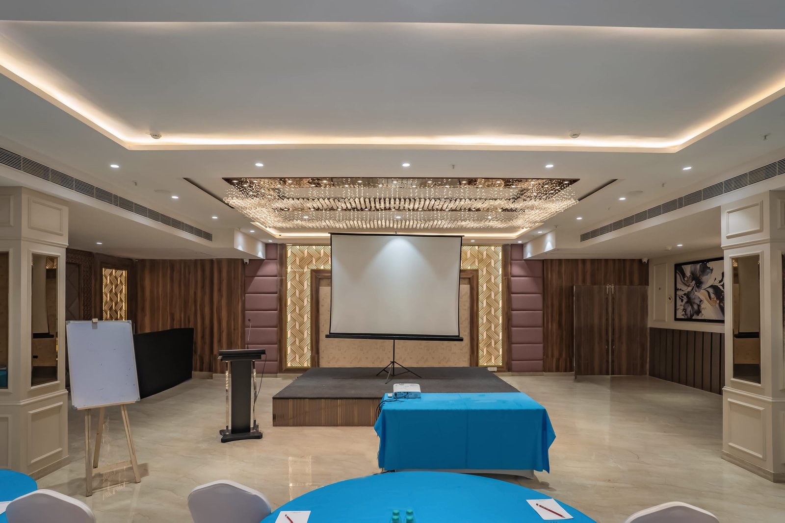 Conference setup with a lectern and projection screen