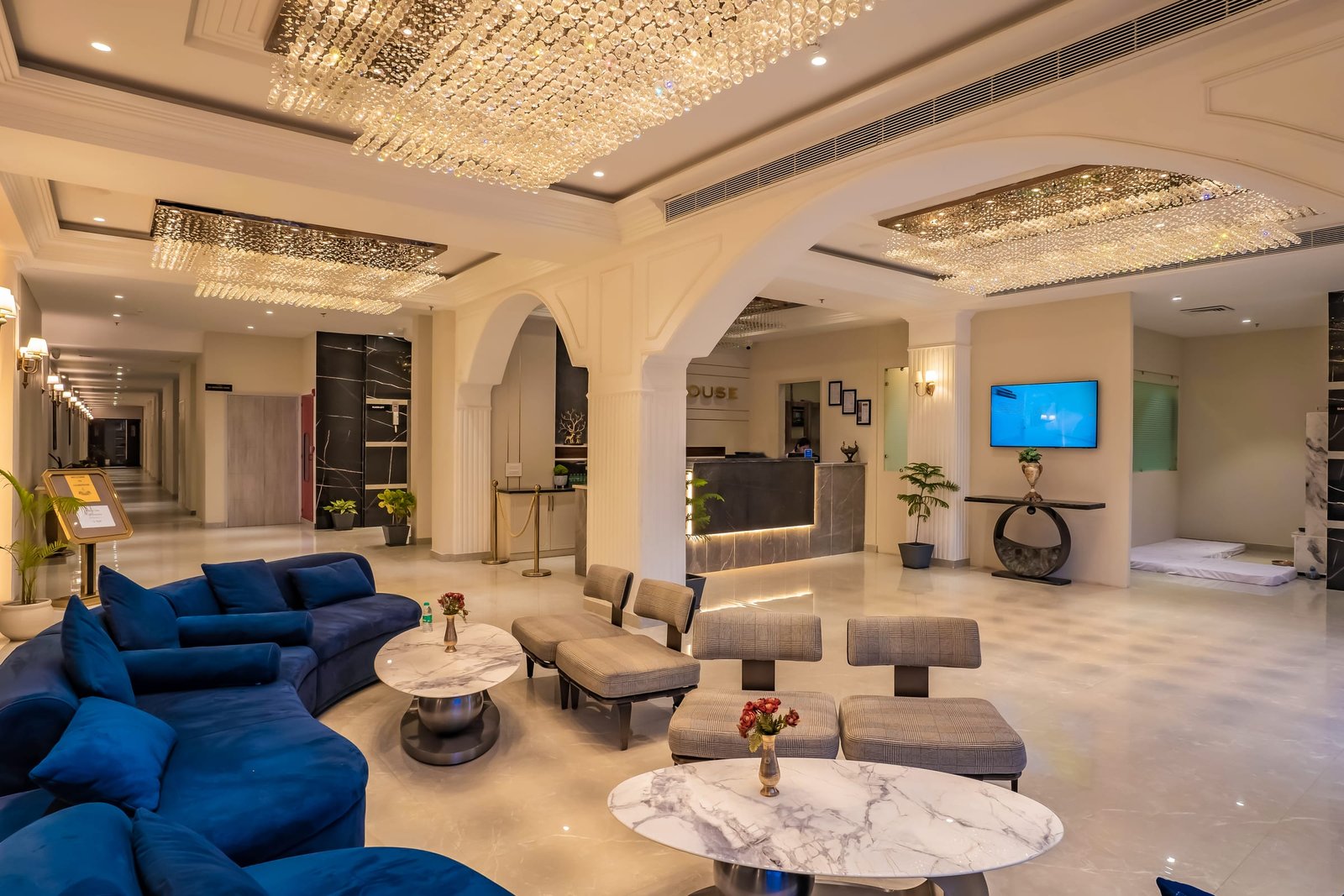 The length of the Club House lobby, marble tables between lounge chairs