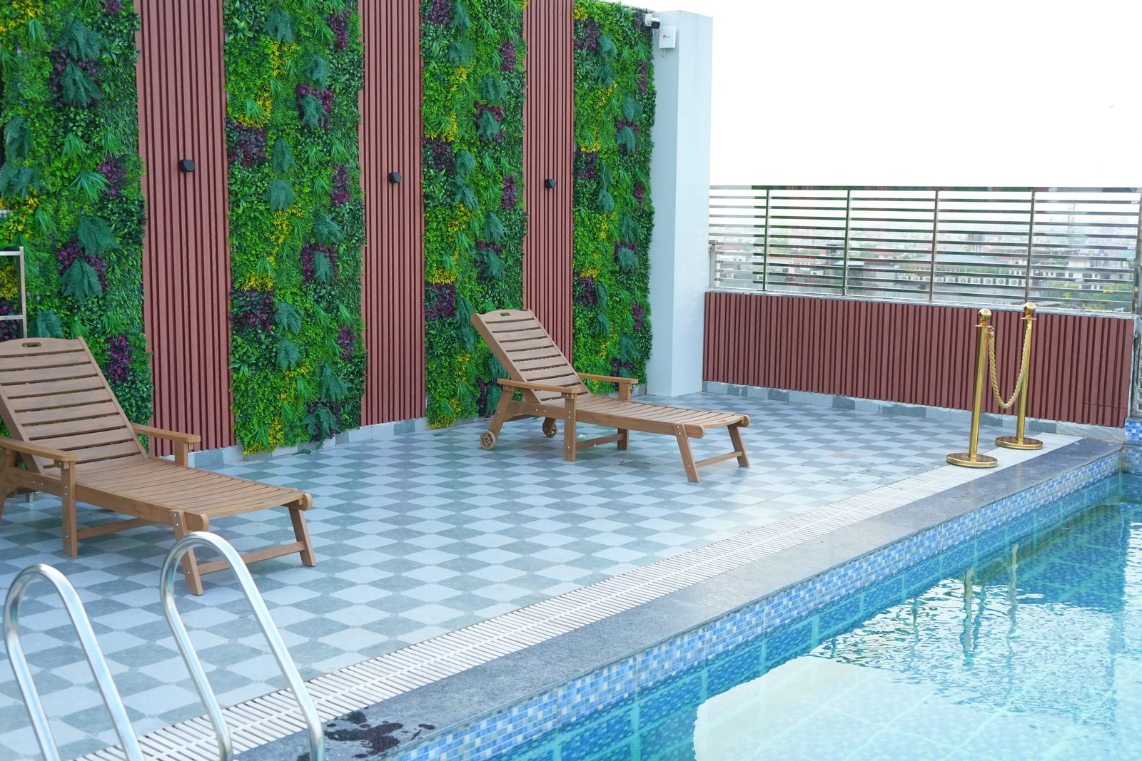 Sun loungers beside the rooftop pool