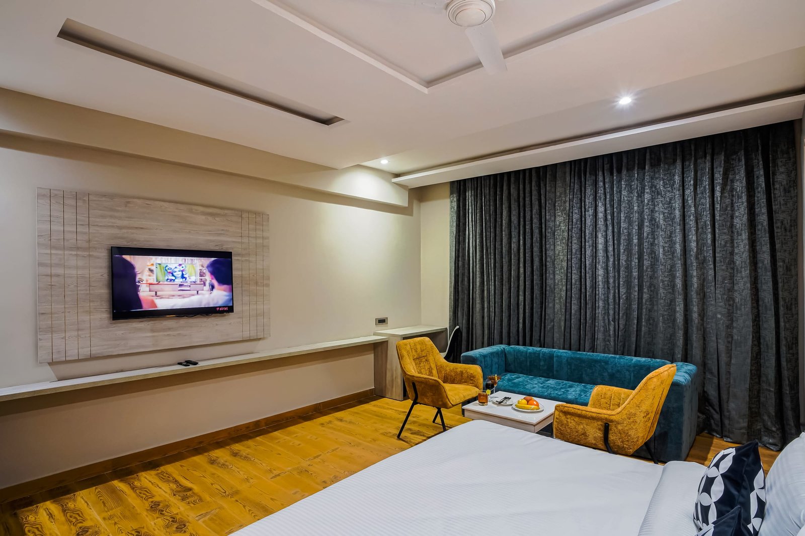 Suite living area with a low table and armchairs
