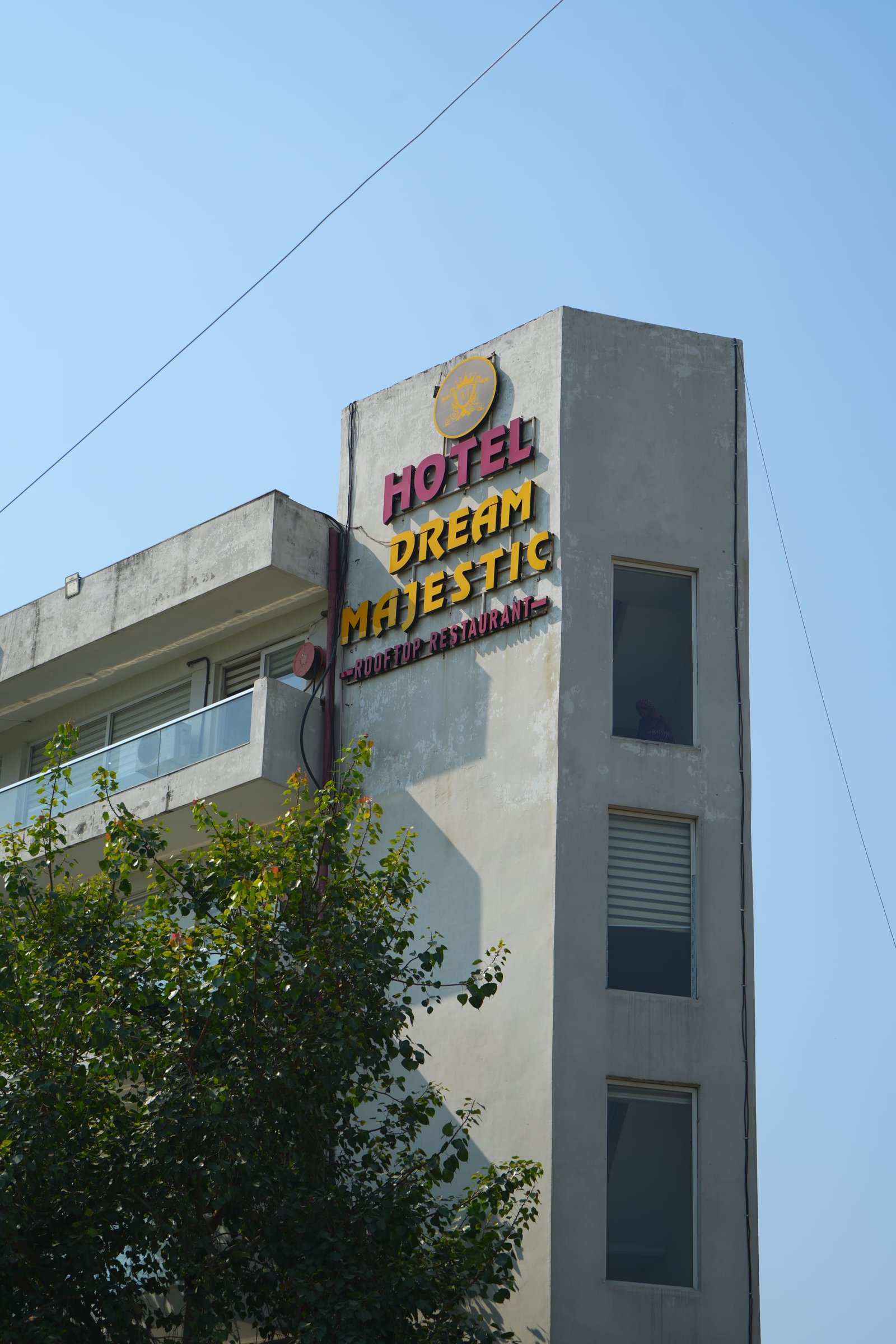 The Hotel Dream Majestic sign on the corner of the building