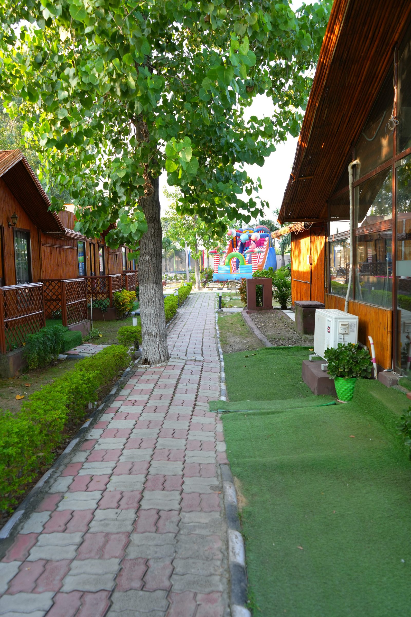The walkway between the huts under the trees