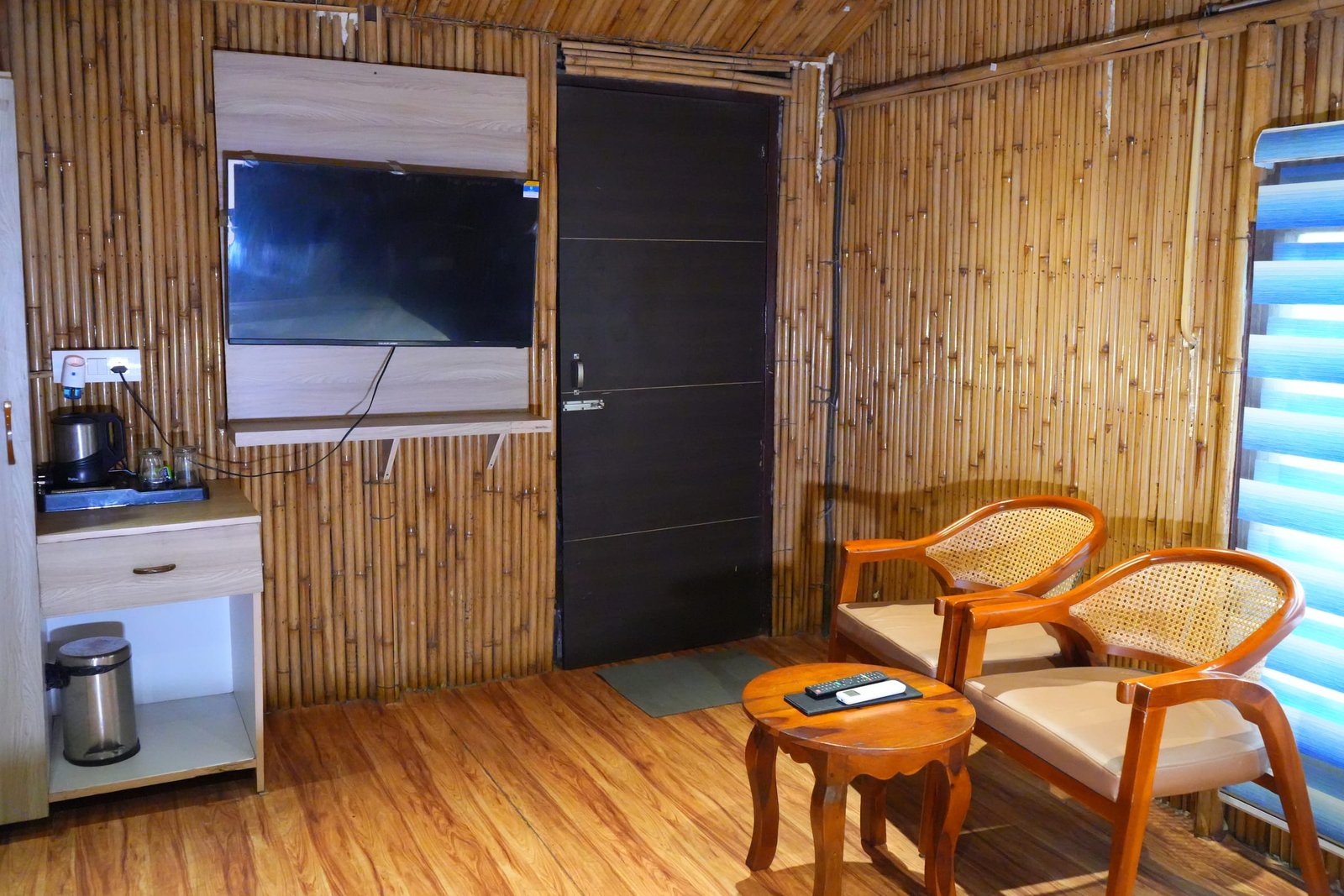 A hut with its tea tray, cane chairs and window