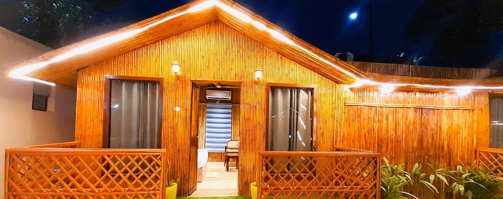 A hut and its verandah at night
