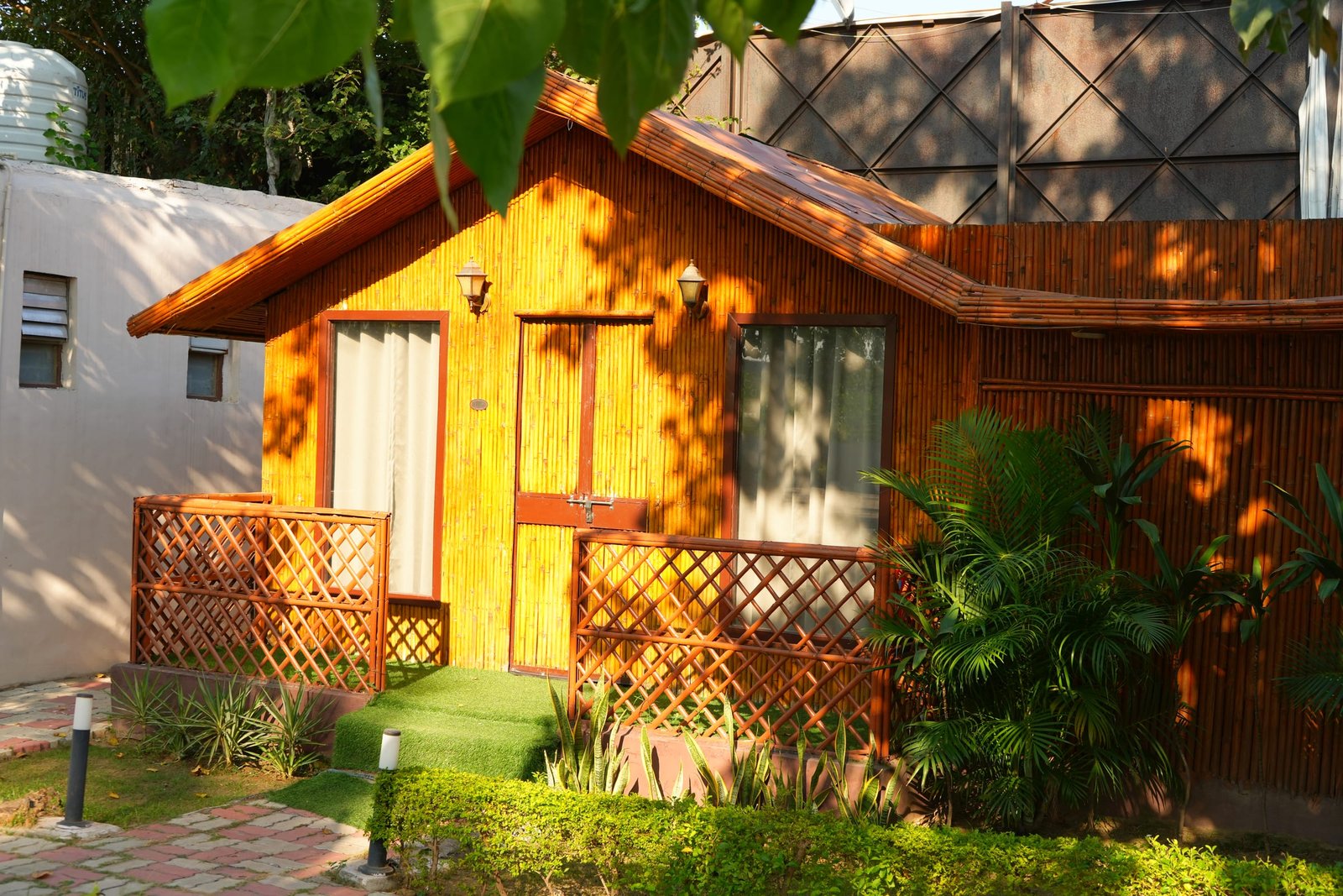 A single bamboo hut with its door and lantern