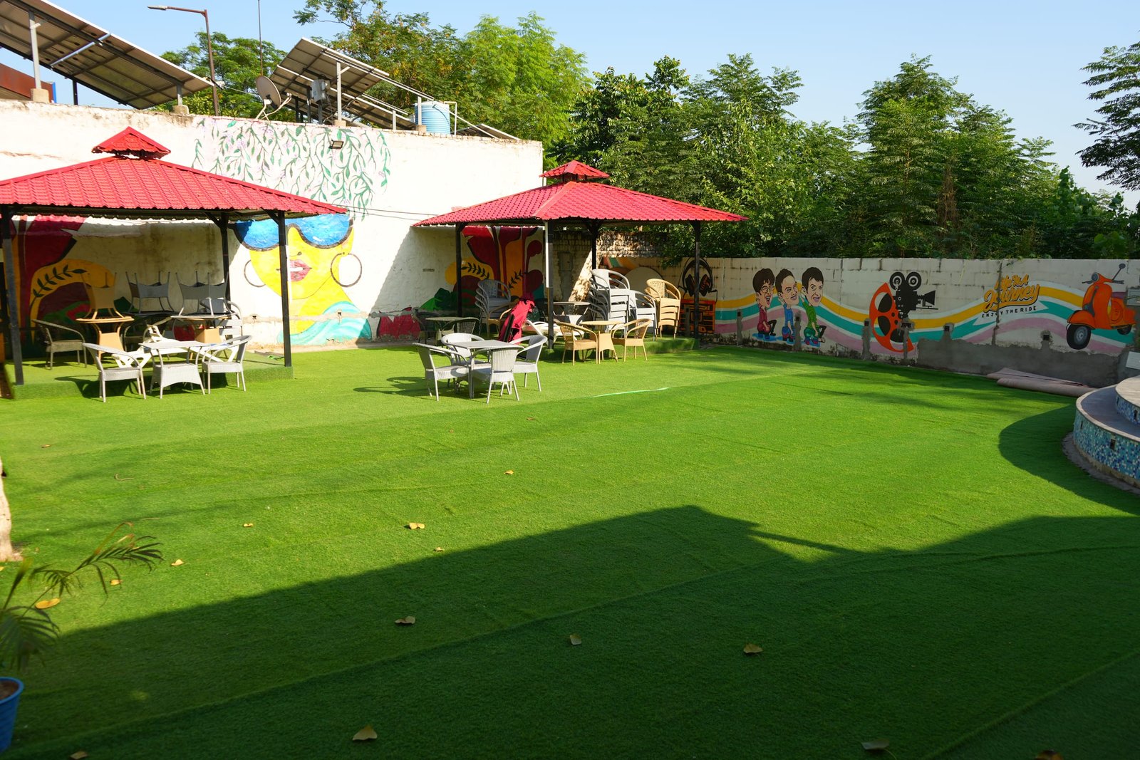 The lawn set with parasols and tables