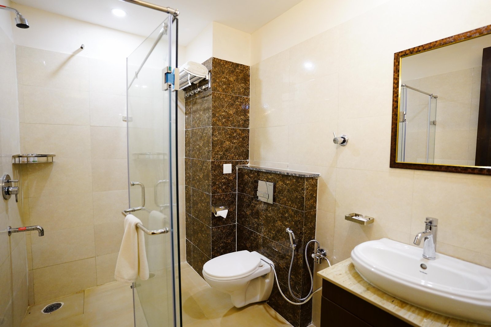 Bathroom with a glazed shower and a stone vanity