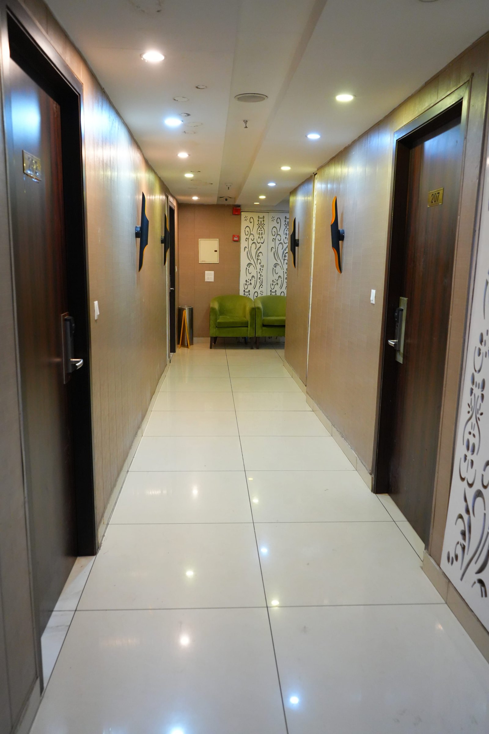 The corridor past its fretwork screen