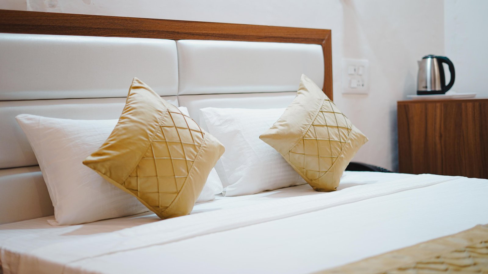 Cushions and a kettle tray at the head of the bed